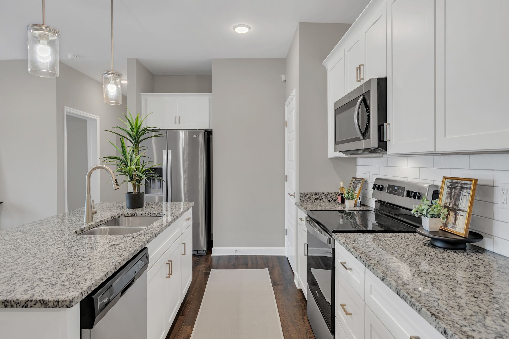 7487 Highway 70 South, Unit 101 Nashville, TN 37221 - Photo 8 of 20 a kitchen with stainless steel appliances granite countertop a sink a stove and a refrigerator