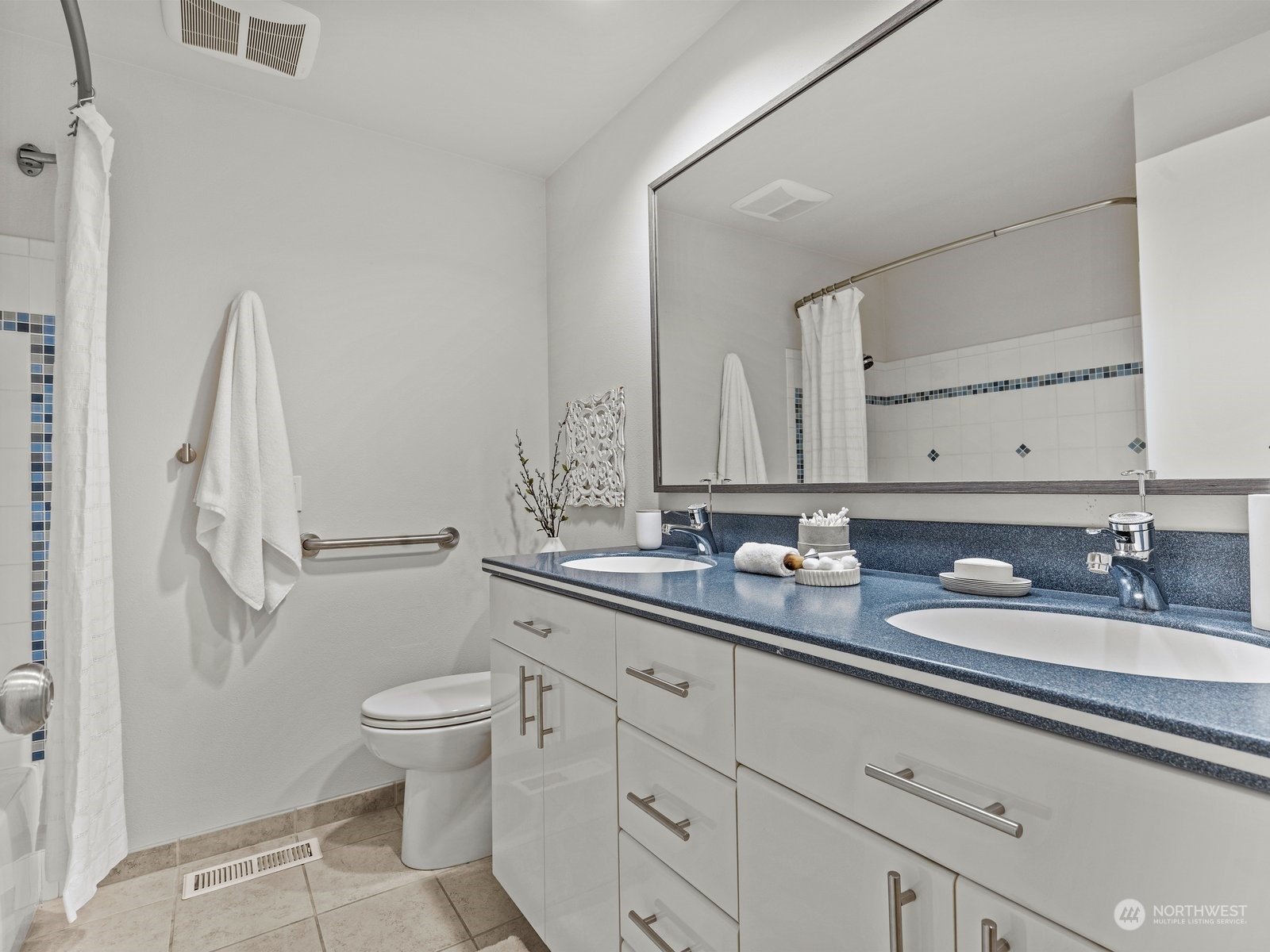 750 Northstream Lane Edmonds, WA 98020 - Photo 20 of 37 a bathroom with a double vanity sink toilet and a mirror
