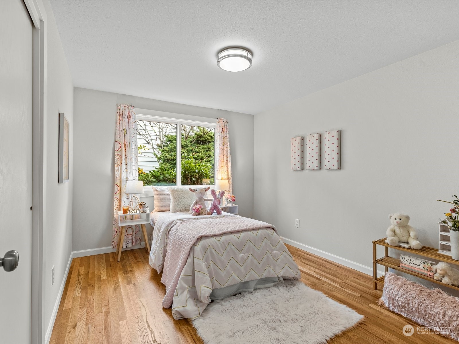 750 Northstream Lane Edmonds, WA 98020 - Photo 22 of 37 a bedroom with a bed and wooden floor