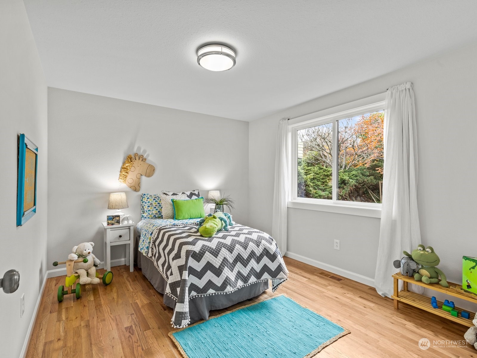 750 Northstream Lane Edmonds, WA 98020 - Photo 23 of 37 a bedroom with a bed window and a lamp