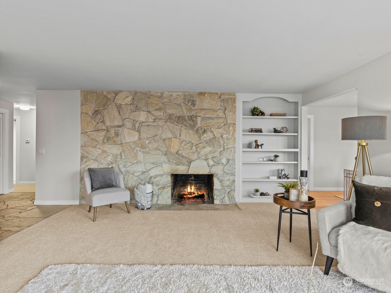 750 Northstream Lane Edmonds, WA 98020 - Photo 7 of 37 a living room with furniture and a fireplace