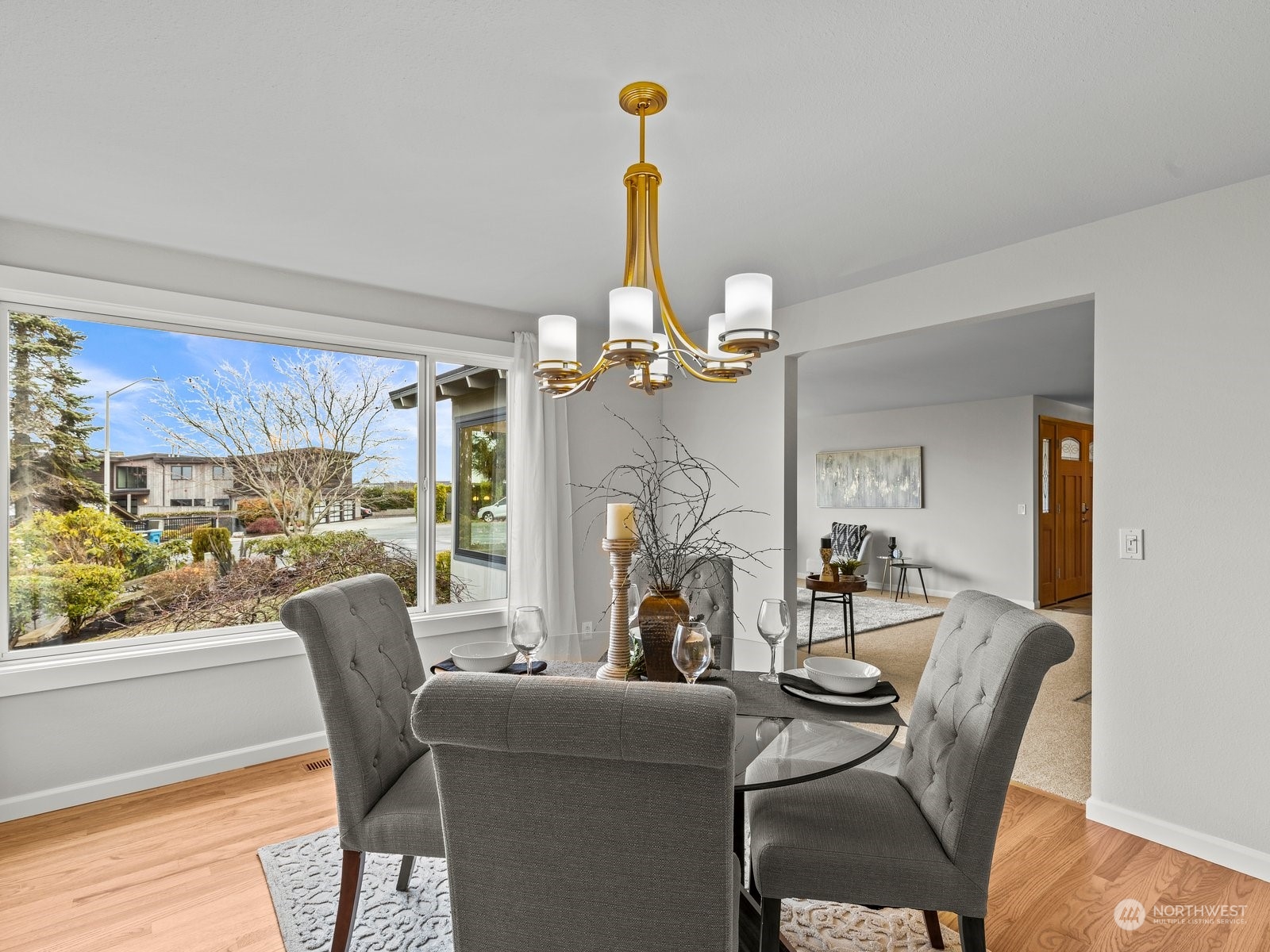 750 Northstream Lane Edmonds, WA 98020 - Photo 9 of 37 a view of a dining room with furniture a chandelier and wooden floor