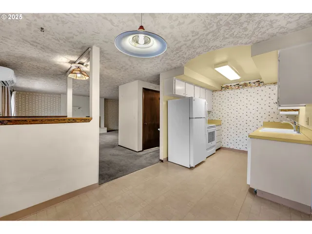 a view of a kitchen with a sink