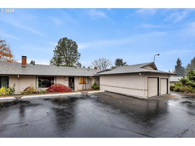 a view of multiple houses with a yard