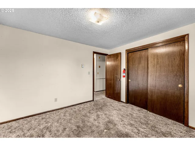a bathroom with a sink mirror and toilet
