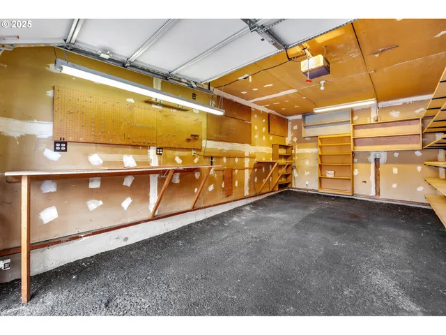 a sign that is sitting on a brick wall