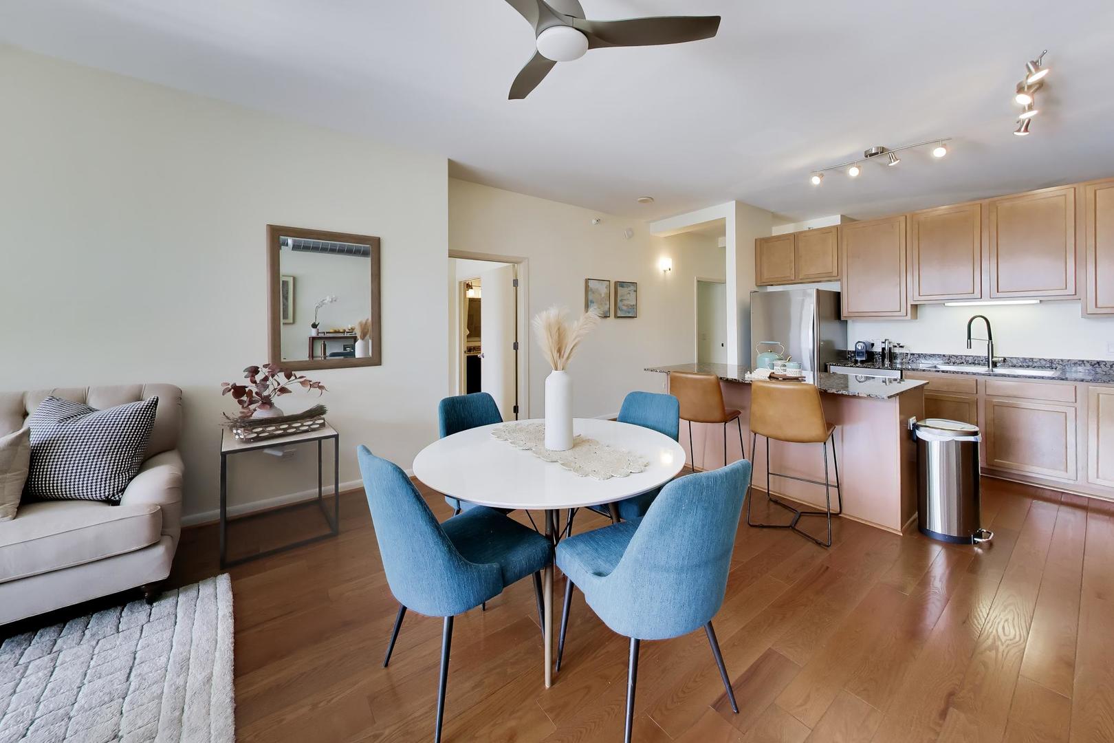 1200 West Monroe Street, Unit 502 Chicago, IL 60607 - Photo 5 of 34 a dining room with furniture and wooden floor