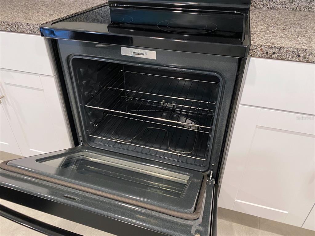 3816 Hanover Drive New Port Richey, FL 34653 - Photo 14 of 64 a stove top oven sitting inside of a kitchen