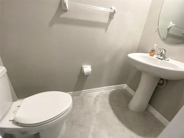 an empty room with closet and windows