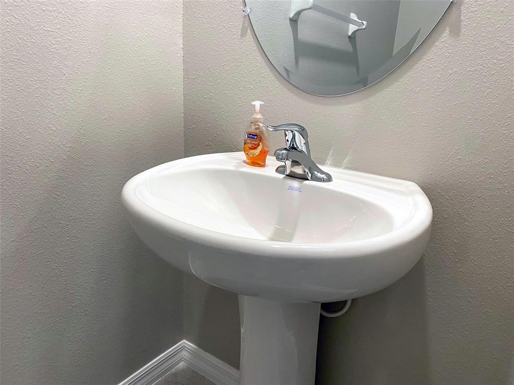 3816 Hanover Drive New Port Richey, FL 34653 - Photo 22 of 64 a bathroom with a sink and mirror
