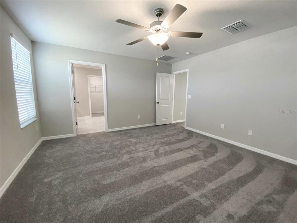 3816 Hanover Drive New Port Richey, FL 34653 - Photo 26 of 64 a view of a livingroom with a ceiling fan and window