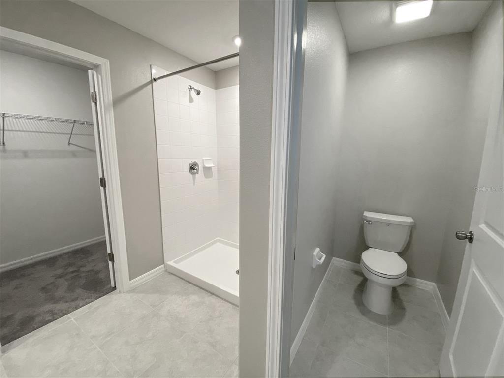 3816 Hanover Drive New Port Richey, FL 34653 - Photo 29 of 64 a bathroom with a toilet and a shower