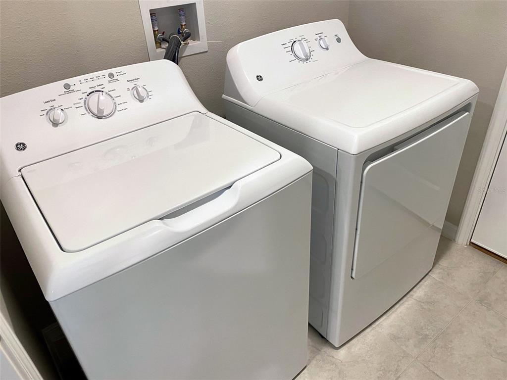 3816 Hanover Drive New Port Richey, FL 34653 - Photo 35 of 64 a utility room with dryer and washer