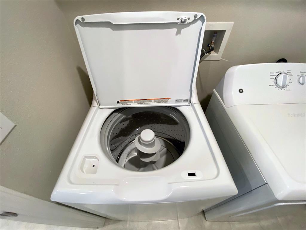 3816 Hanover Drive New Port Richey, FL 34653 - Photo 36 of 64 a utility room with dryer and washer