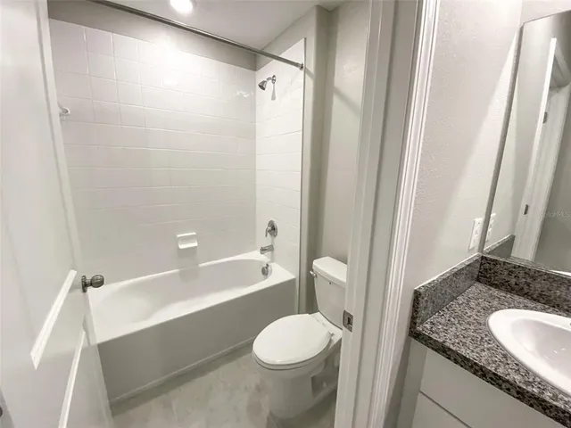 an aerial view of a house with yard swimming pool and outdoor seating