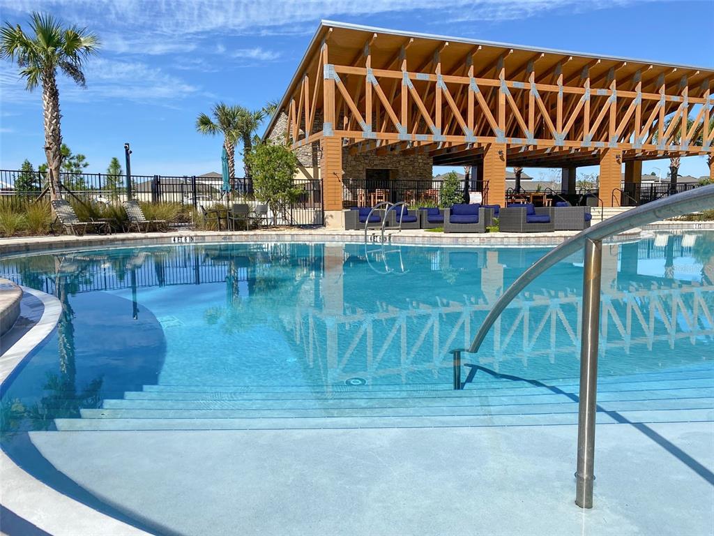 3816 Hanover Drive New Port Richey, FL 34653 - Photo 60 of 64 a view of swimming pool with outdoor seating