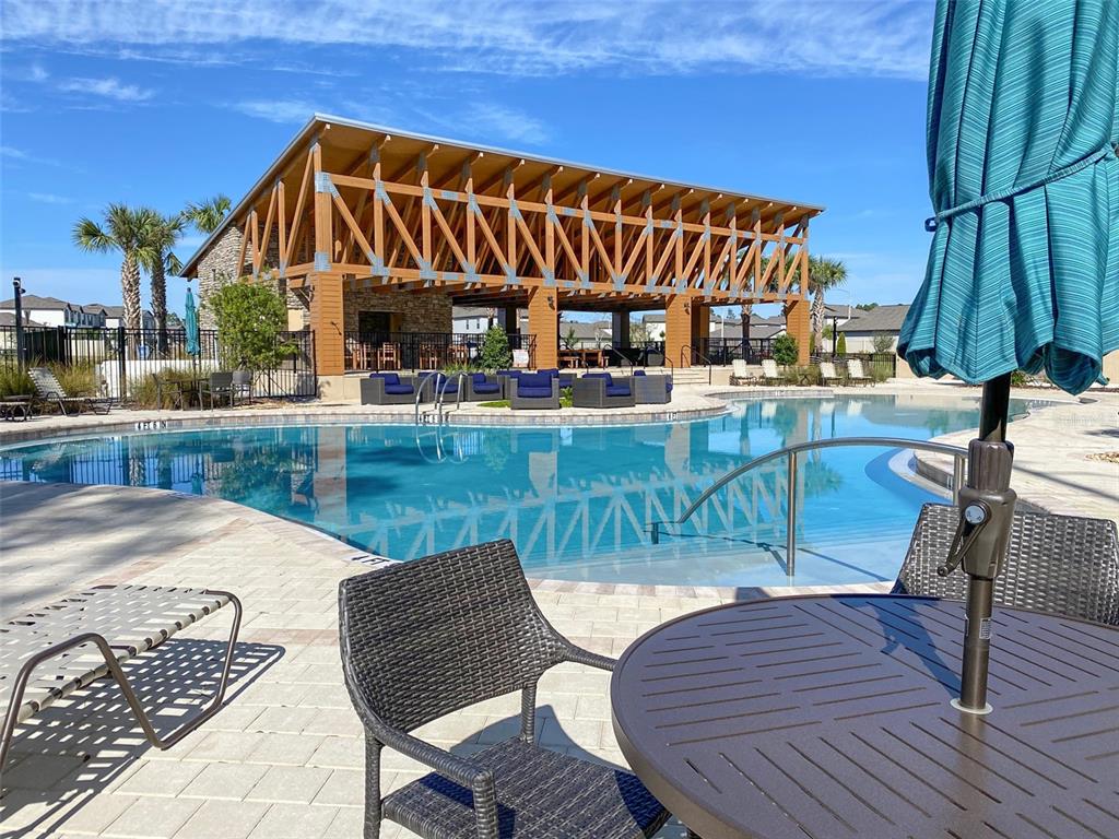 3816 Hanover Drive New Port Richey, FL 34653 - Photo 64 of 64 a view of a chair and tables in the patio