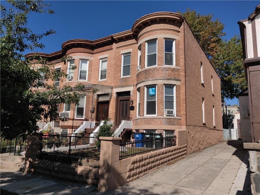 339 76th Street Brooklyn, NY 11209 - Photo 1 of 1 a front view of a residential apartment building with a yard