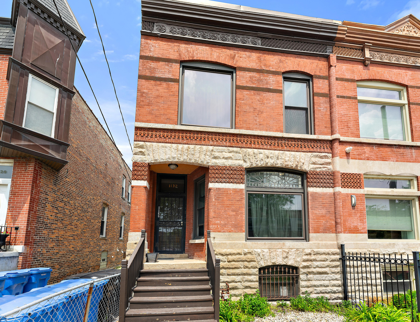 1132 East 44th Street Chicago, IL 60653 - Photo 1 of 23 a view of a brick house with large windows