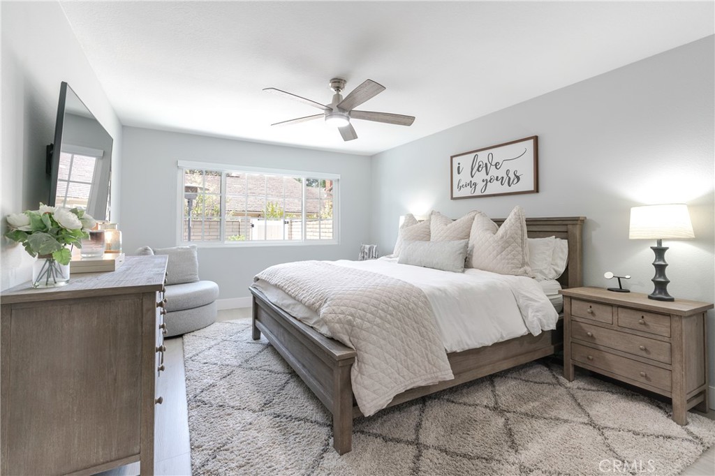 12 Juniper Irvine, CA 92612 - Photo 13 of 26 a bedroom with a bed and a chandelier