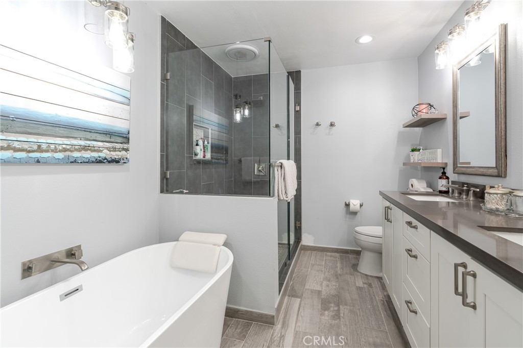 12 Juniper Irvine, CA 92612 - Photo 16 of 26 a bathroom with a sink a toilet and shower