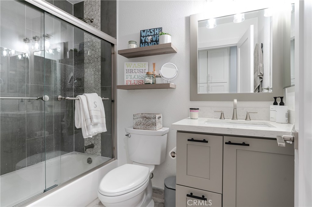 12 Juniper Irvine, CA 92612 - Photo 19 of 26 a bathroom with a sink a toilet and shower