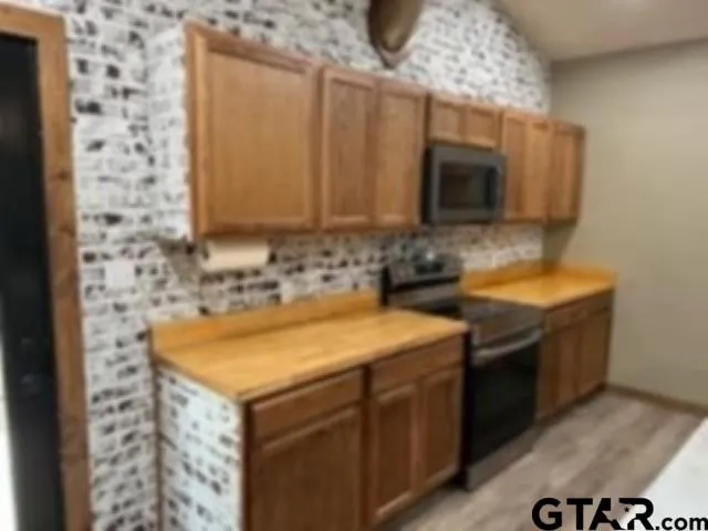 a bathroom with a sink and a microwave