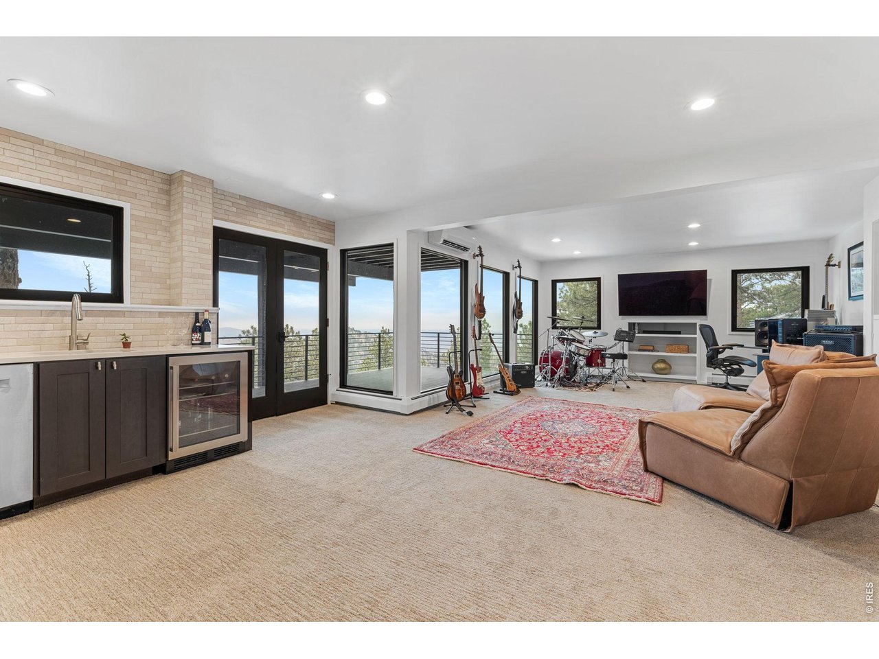 93 Hawk Lane Boulder, CO 80304 - Photo 34 of 50 Expansive recreation room with walk-out deck and entertaining wetbar