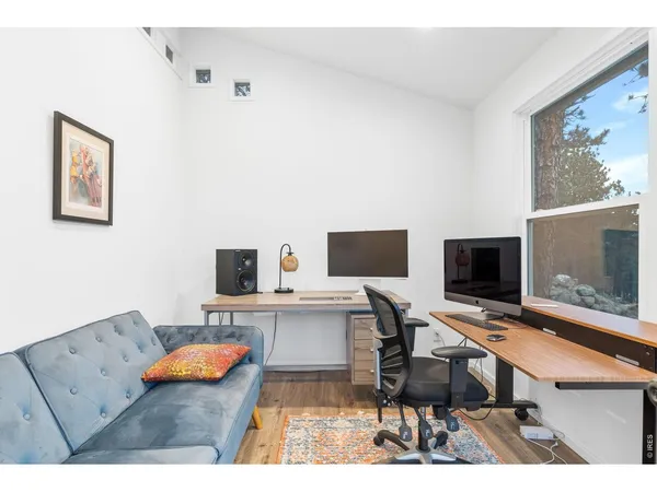 a view of a workspace with furniture