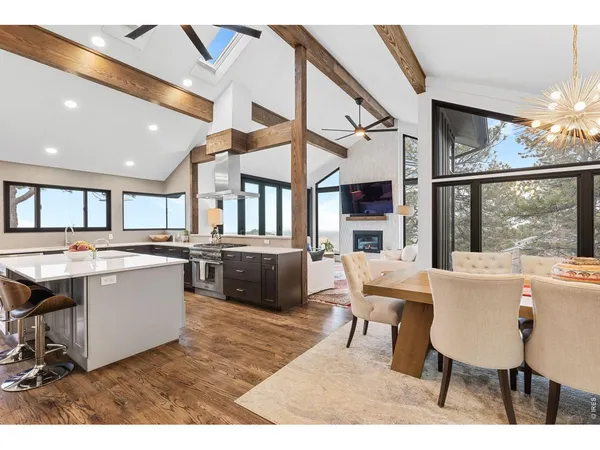 a large white kitchen with a table and chairs