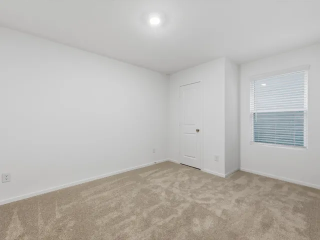 a view of an empty room and window