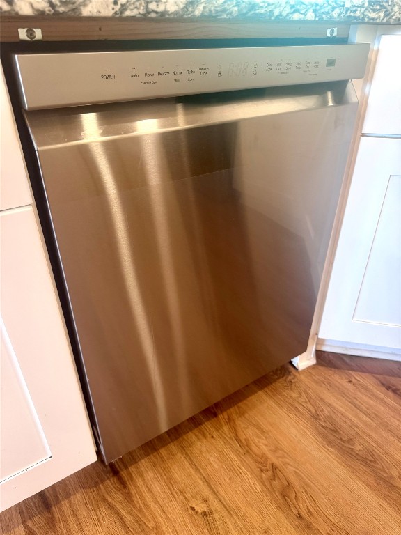 6011 Nuckols Crossing Road Austin, TX 78744 - Photo 13 of 24 Kitchen view of dishwasher and wood finished floors