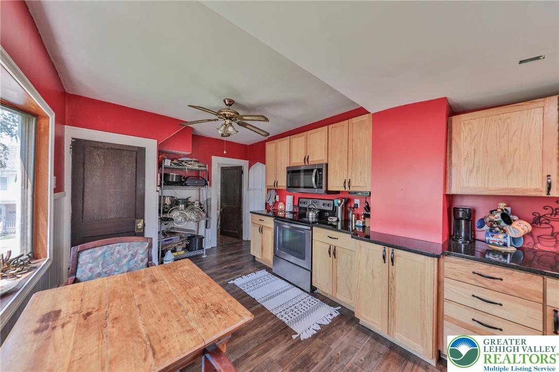417 3rd Street Lehighton, PA 18235 - Photo 5 of 39 This kitchen presents a practical layout with ample cabinetry and essential appliances for everyday living.