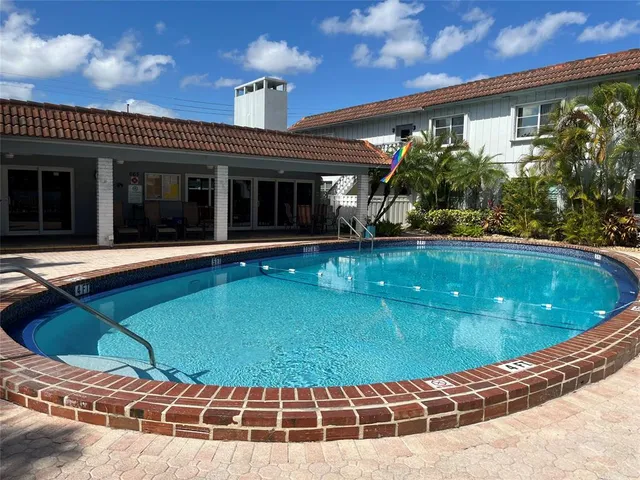a view of a swimming pool with a patio