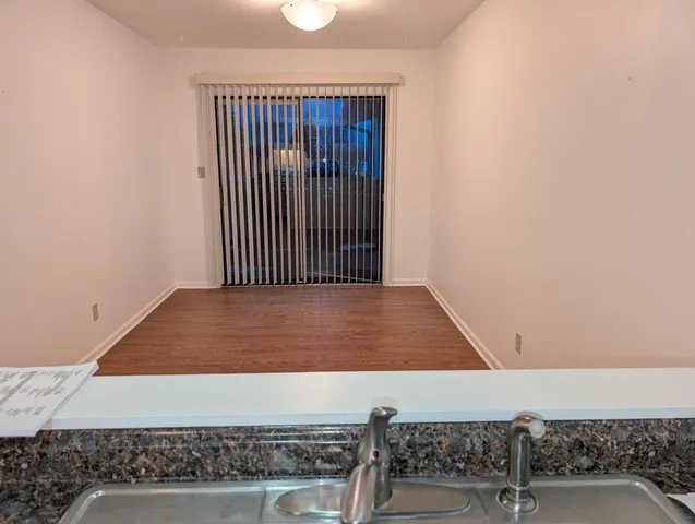 an empty room with a ceiling fan