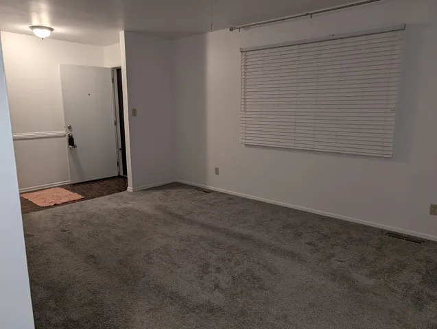 a kitchen with granite countertop cabinets stainless steel appliances and sink