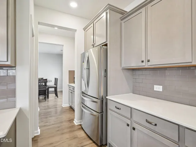 a kitchen with cabinets and stainless steel appliances