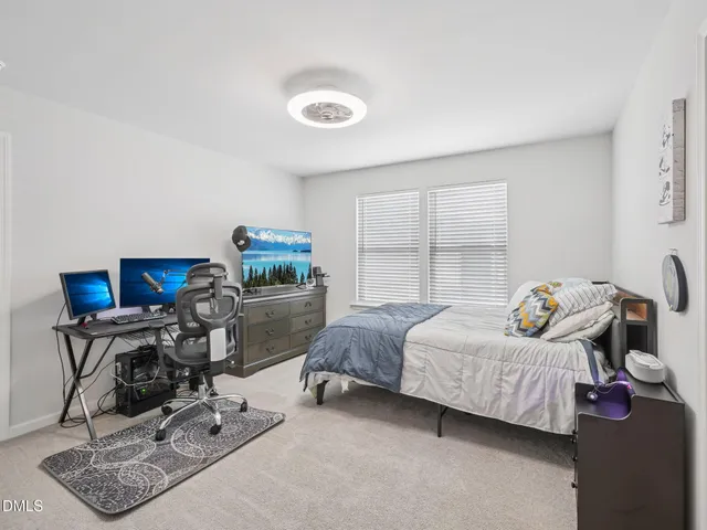 a bedroom with furniture and a window