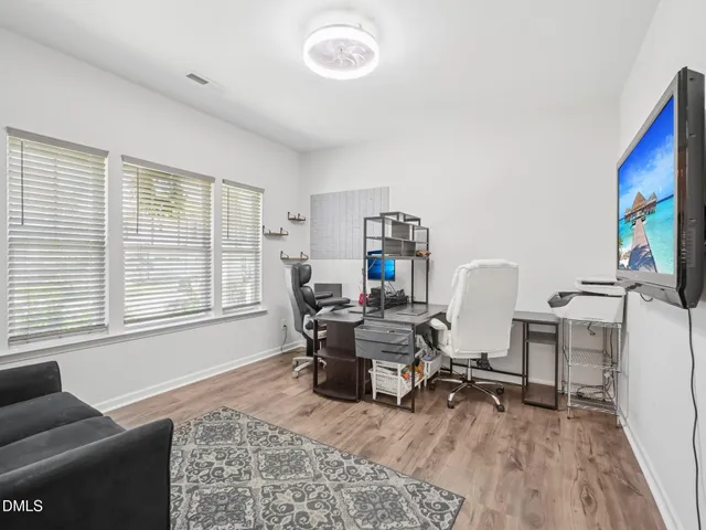 a work room with furniture and a window