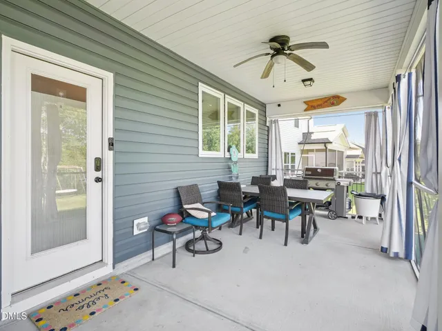 a view of a livingroom with furniture and a window