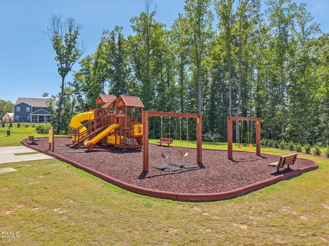 a view of a park with large trees
