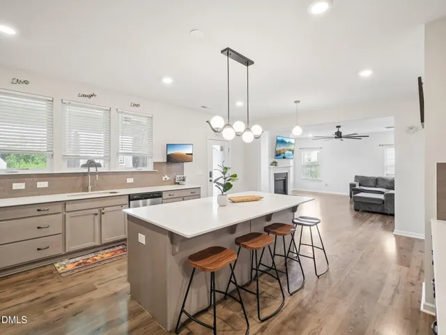 a kitchen with a table and chairs in it