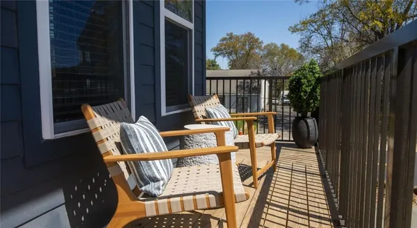 a view of balcony with furniture