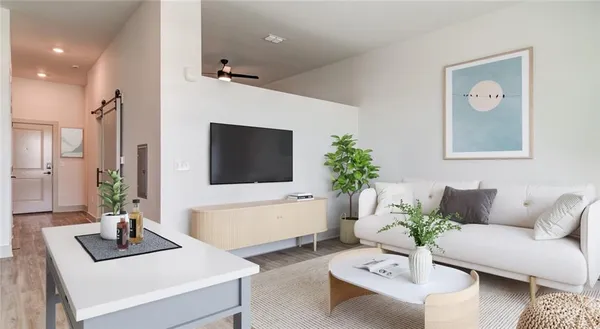 a living room with furniture and a flat screen tv