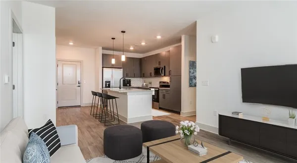 a living room with furniture and a flat screen tv