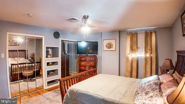 a bathroom with a granite countertop toilet and a shower