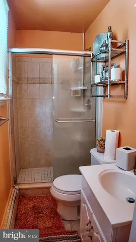 a bedroom that has a bed and a dresser in it