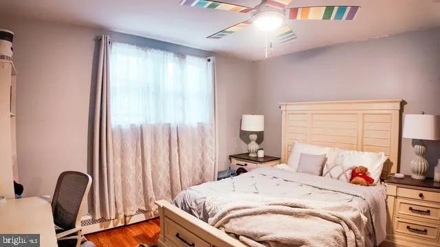 a bed room with a bed and a desk