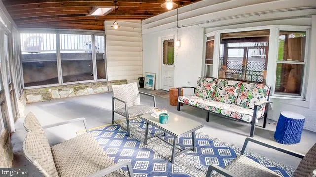 a dining room with furniture water view and a garden