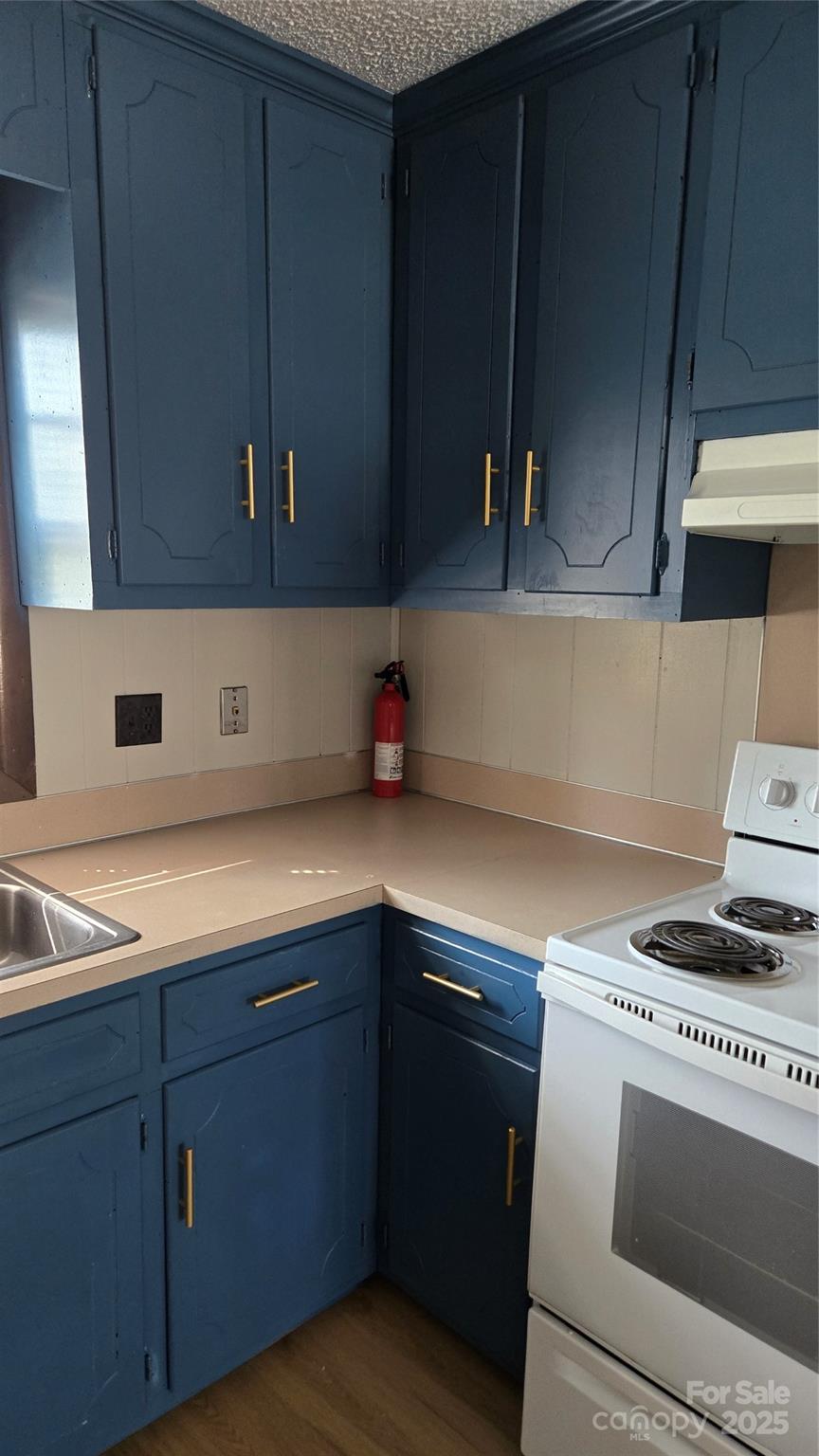 1554 Barringer Street Mount Pleasant, NC 28124 - Photo 5 of 6 a kitchen with a sink and cabinets